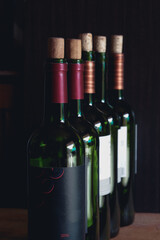 Close up of opened wine bottles ready to serve.