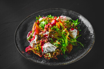 Plate of fresh salad with grilled chicken, pear, cream cheese in plate