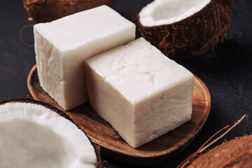 Coconut handmade soap and coco on dark concrete background