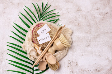 Zero Waste Eco Friendly Concept Bathroom and Kitchen Accessories in Eco Bag on Concrete Background...