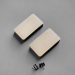 Brown paper business cards on gray background. Mockup for branding identity.