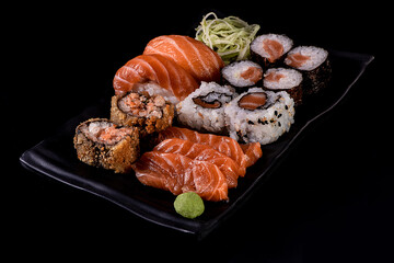 close up of japanese food on black background