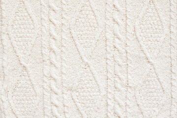 Cables knitting stitch pattern,  handmade knitted clothes texture of natural color thread, ladies...