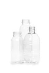 three different empty plastic bottles isolated on white background. production of new containers