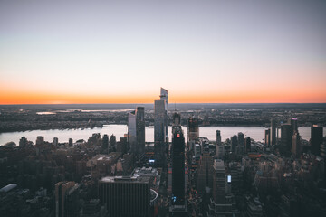 beautiful sunset heights new york city skyline orange sky streets buildings sea 