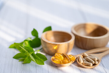 Alternative medicine herbal organic capsule with vitamin E omega 3 fish oil, mineral, drug with herbs leaf natural supplements for healthy good life.