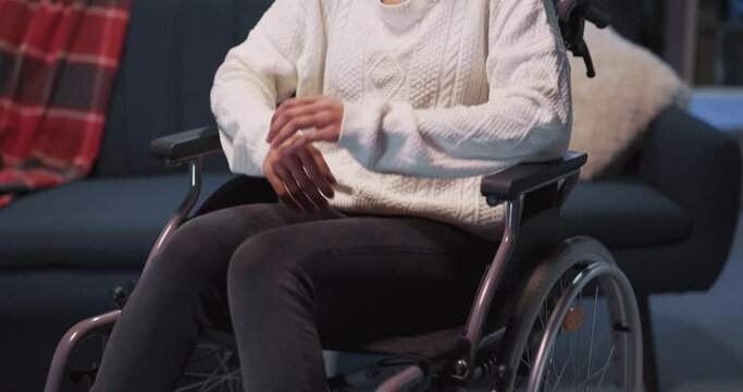 Full body portrait of african young beautiful girl with disabilities sitting in wheelchair posing seriosly to camera. Healthcare concept. Disabled girl.