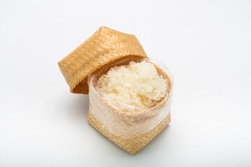 Thai sticky rice in a bamboo wooden on white background