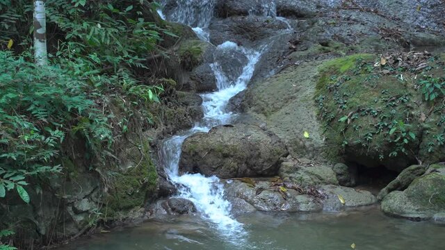 Sa Nang Manora waterfall in Phang Nga, Thailand, wonderful fresh water, small green waterfalls. Looks comfortable.