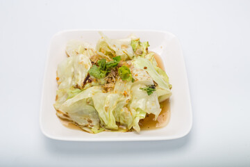 Stir Fried Cabbage with Fish Sauce, White Square Plate on white background