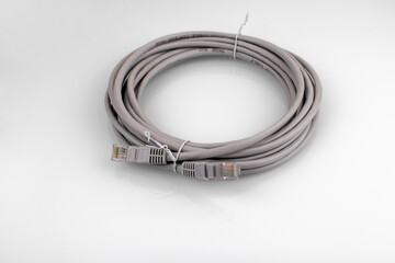 Fototapeta premium Internet cable on a white background. Connecting a computer to a network or LAN