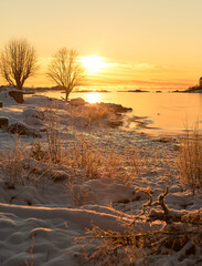 sunset over the lake in winter