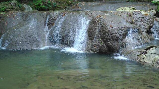 Sa Nang Manora waterfall in Phang Nga, Thailand, wonderful fresh water, small green waterfalls. Looks comfortable.