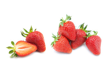 Ripe fresh organic strawberries in a pile, whole and half with leaves isolated on white background.