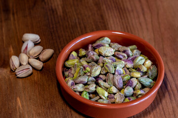 pistachios  on rustic wood table