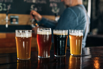 close up of cold fresh beer on bar counter