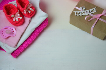 Baby girl knitted sandal, booties, shoes baby newborn, blank postcard. cocept it s a girl or baby shouer