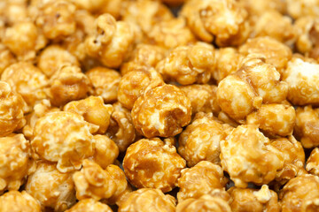 Popcorn in caramel close-up. Macro photography. Caramelized popcorn. Popcorn background.
