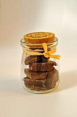 small glass container containing pieces of chocolate
