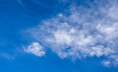 Naklejka na ściany i meble Cloud in the blue sky of a sunny day