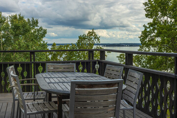 Overview of outdoor wooden veranda around private house with gorgeous landscape  on Baltic sea. Beautiful backgrounds of nature. Sweden.