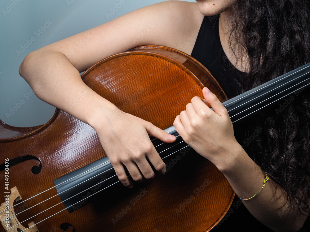 Sticker Closeup shot of a female holding the cello