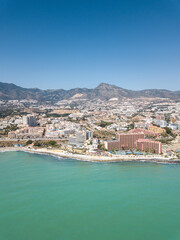 Fototapeta premium Aerial perspective of beautiful Andalusian city Benalmadena. Situated in south of Spain is a famous touristic destination on Costa del Sol. Emerald water colour. golden mile beach. Malaga Province 