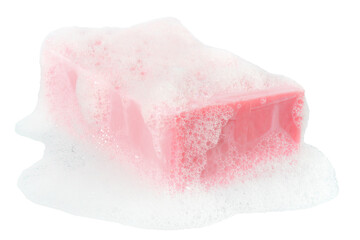 Bar of pink soap in the foam close up isolated