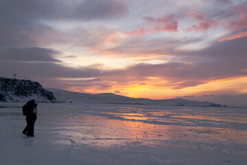 silhouette of a person on the frozen lake 