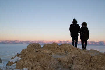 silhouette of couple on the hill