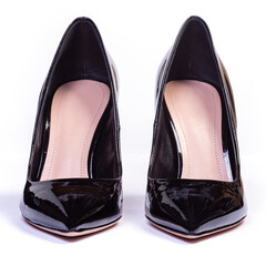 Women's black shoes on a white background..