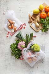 Zero waste concept. Eco bags with fruits and vegetables. Eco-friendly shopping and cooking concept, flat lay