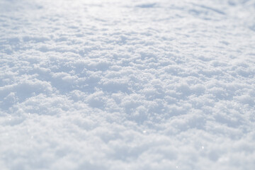 Snow texture. Top view of the white snow. Background with copy space. Winter time