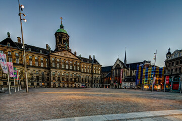  Iconic buildings along the streets and canals of Amsterdam around Dam Square, early morning