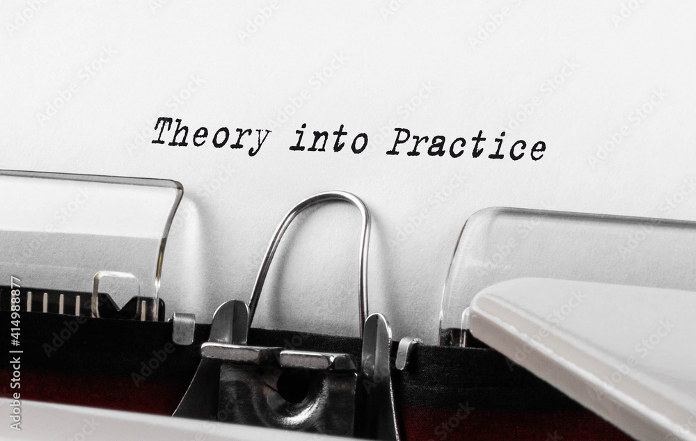 Poster text theory into practice typed on retro typewriter