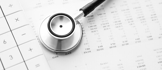 Stethoscope and calculator. Concept of health care costs or medical insurance