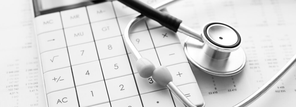 Stethoscope and calculator. Concept of health care costs or medical insurance