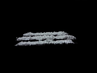 Cocaine drug powder lines on black background