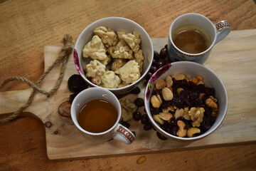Nuts and coffee on platter
