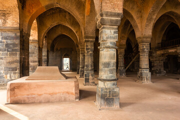 A stone tomb in an arcaded hall at the ruins of the ancient Adina Masjid mosque in the village of Pandua.