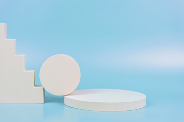 Abstract geometric pastel color product display podium on light blue background. Minimal different shapes scene stage showcase stand for product promotion presentation