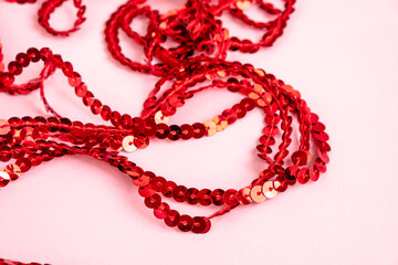 Red glitter texture backgroung. Selective focus