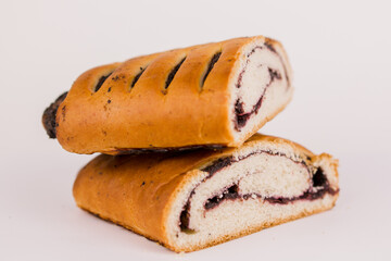 butter bun with poppy seeds on a white plate