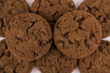 chocolate chip cookies with chocolate pieces on white background