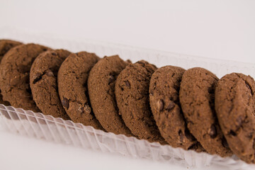 chocolate chip cookies with chocolate pieces on white background