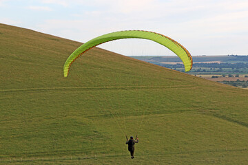 Paraglider flying at Milk Hill, Wiltshire