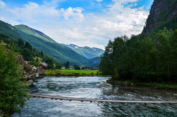 Beautiful Norwegian landscape with mountain pure cold water river and amazing fjords on background, near Flam, Norway