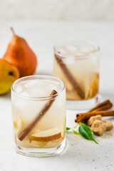 Sparkling pear cinnamon  cocktail in glasses. Space for text.