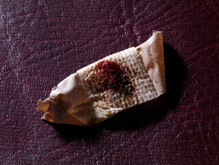 Old bloodied sticking plaster or adhesive bandage