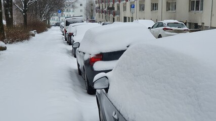 Snow covered cars in a residential area in Oslo, Norway